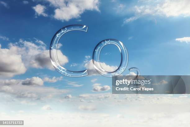 floating co2  text on the sky - molecule carbon imagens e fotografias de stock