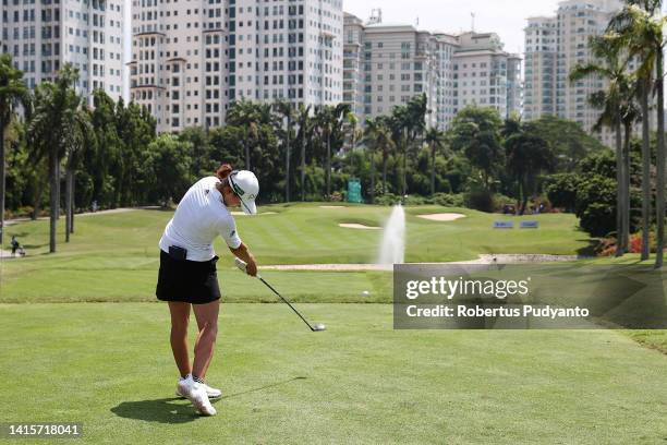 Hinako Shibuno of Japan hits her tee shot on the 8th hole during day two of the Simone Asia Pacific Cup at Pondok Indah Golf Course on August 19,...