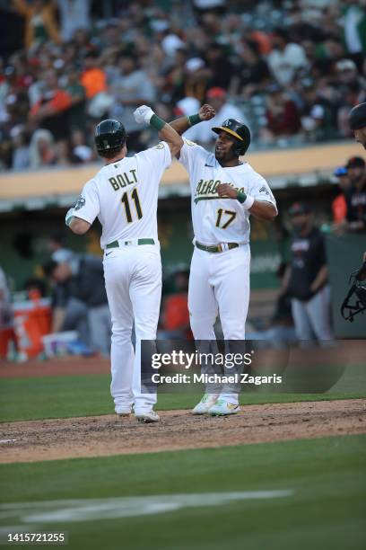 Skye Bolt of the Oakland Athletics celebrates with Elvis Andrus after hitting a home run during the game against the San Francisco Giants at...