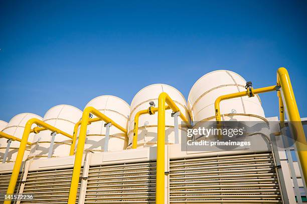 sets of cooling towers in conditioning systems - energy industry heat steam stock pictures, royalty-free photos & images