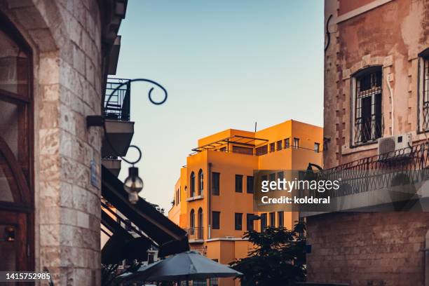 renovated historic buildings at sunset - tel aviv stock pictures, royalty-free photos & images