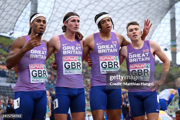 Alex Haydock-Wilson, Rio Mitcham, Lewis Davey and Joseph Brier of Great Britain celebrate following the Men's 4 x 400m Relay Round 1 - Heat 2 during...