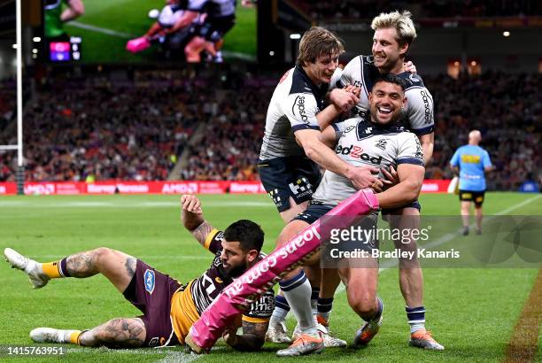 David Nofoaluma of the Storm celebrates scoring a try during the round 23 NRL match between the Brisbane Broncos and the Melbourne Storm at Suncorp...