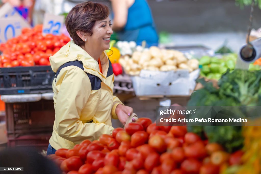 Tourist woman shopping at a local market