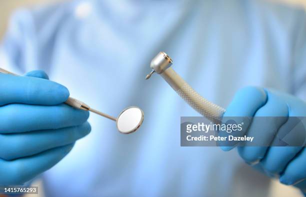 dentist with drill - dentist phobia stock-fotos und bilder