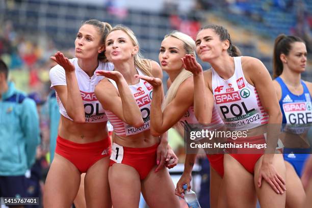 Natalia Kaczmarek, Malgorzata Holub-Kowalik, Justyna Swiety-Ersetic and Kinga Gacka of Poland celebrate following the Women's 4x400m Relay Round 1 -...