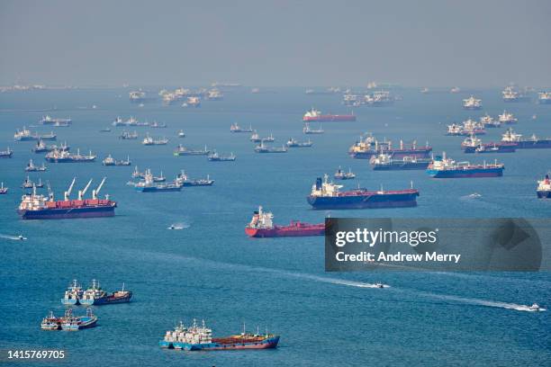 commercial ships at sea, singapore strait - frachtschiff stock-fotos und bilder