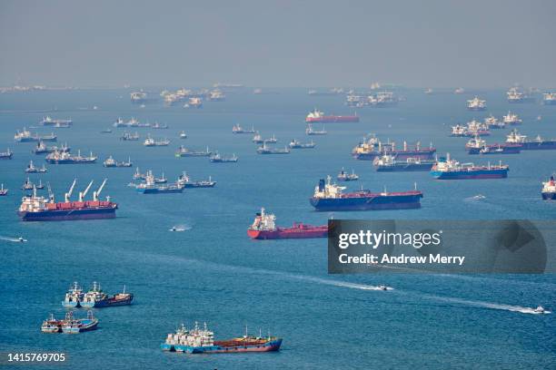 commercial ships at sea, singapore strait - containerschiff stock-fotos und bilder