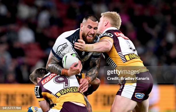 Nelson Asofa-Solomona of the Storm takes on the defence during the round 23 NRL match between the Brisbane Broncos and the Melbourne Storm at Suncorp...
