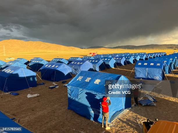 Workers set up tents at a makeshift hospital for COVID-19 patients on August 17, 2022 in Gerze County, Ngari Prefecture, Tibet Autonomous Region of...