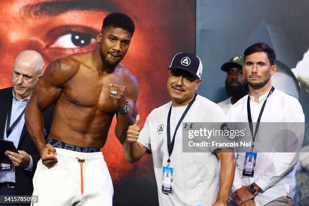 Anthony Joshua and their coach Robert Garcia react after the Weigh-In for Oleksandr Usyk v Anthony Joshua Rage on the Red Sea event at King Abdullah...