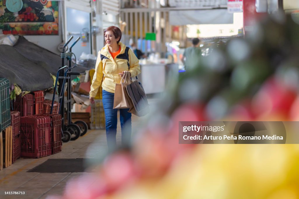 Tourist walking in a local market ready to shop