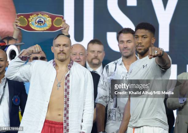 Oleksandr Usyk and Anthony Joshua pose for the cameras during the weigh-in for the Rage on the Red Sea Heavyweight Title Fight at King Abdullah...