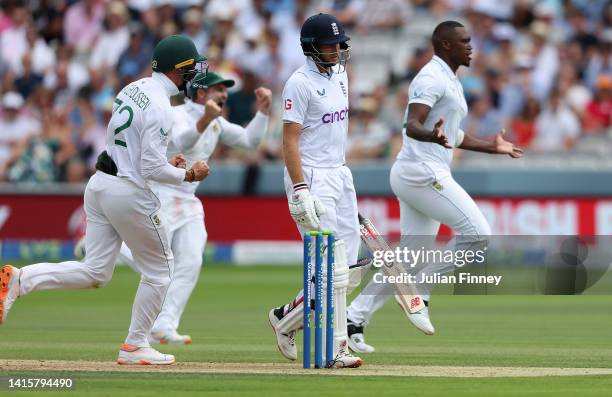 Lungi Ngidi of South Africa celebrates taking the wicket of Joe Root of England during day three of the first LV=Insurance test match between England...