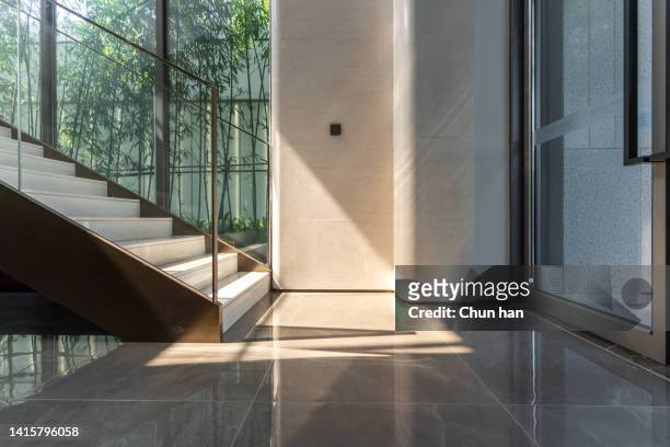 the sun shines on the stairs inside - concrete stairs stock pictures, royalty-free photos & images