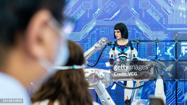 Humanoid robot is on display at the booth of China North Industries Group Corporation during the 2022 World Robot Conference at Beijing Etrong...