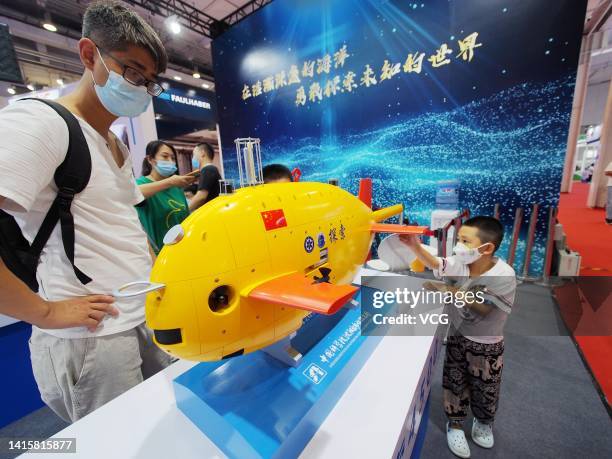 An autonomous underwater vehicle is on display at the booth of the Shenyang Institute of Automation, Chinese Academy of Sciences during the 2022...