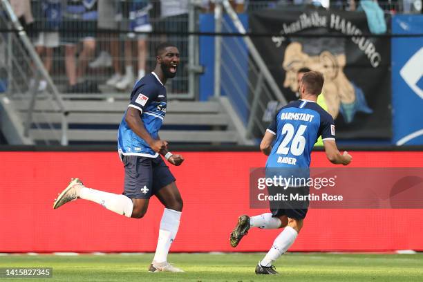 Patric Pfeiffer of Darmstadt celebrates their team's first goal with teammate Matthias Bader during the Second Bundesliga match between Hamburger SV...