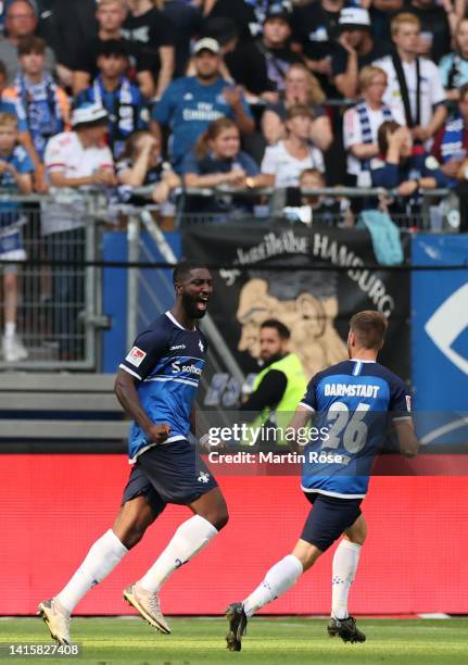 Patric Pfeiffer of Darmstadt celebrates their team's first goal with teammate Matthias Bader during the Second Bundesliga match between Hamburger SV...