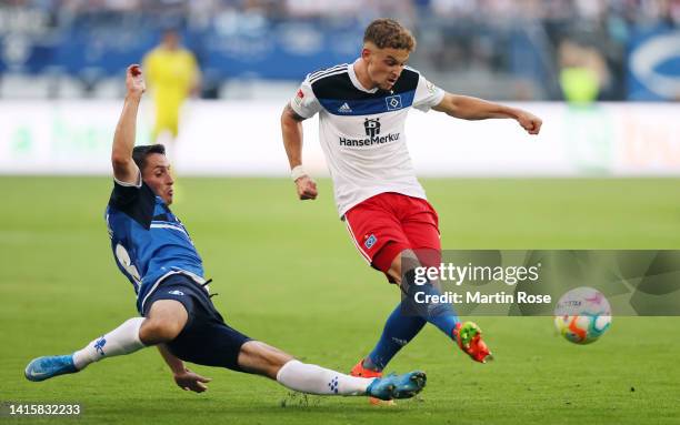 Moritz Heyer of Hamburger SV is challenged by Fabian Schnellhardt of Darmstadt during the Second Bundesliga match between Hamburger SV and SV...