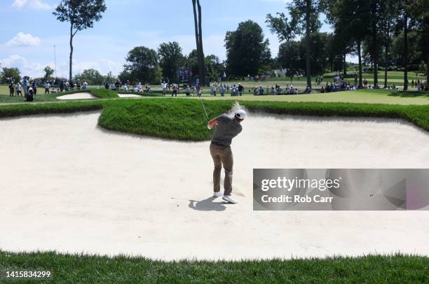 Scott Stallings of the United States plays a shot from a bunker on the 14th hole during the second round of the BMW Championship at Wilmington...