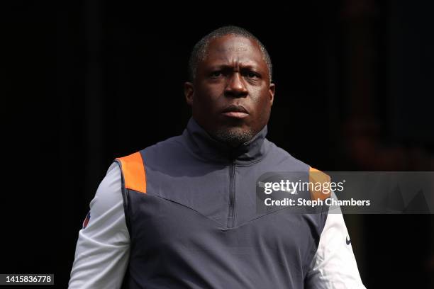 Defensive coordinator Alan Williams of the Chicago Bears heads to the field for warmups during the preseason game between the Seattle Seahawks and...