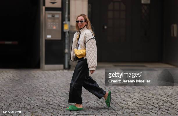 Sonia Lyson wearing Prada yellow triangle leather bag, Dorothee Schumacher green fluffy sandals, The Frankie Shop vegan leather pants, Weekday white...