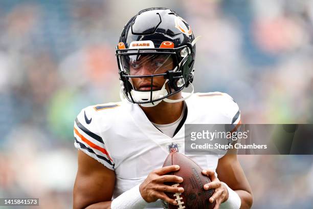 Justin Fields of the Chicago Bears warms up before the preseason game between the Seattle Seahawks and the Chicago Bears at Lumen Field on August 18,...
