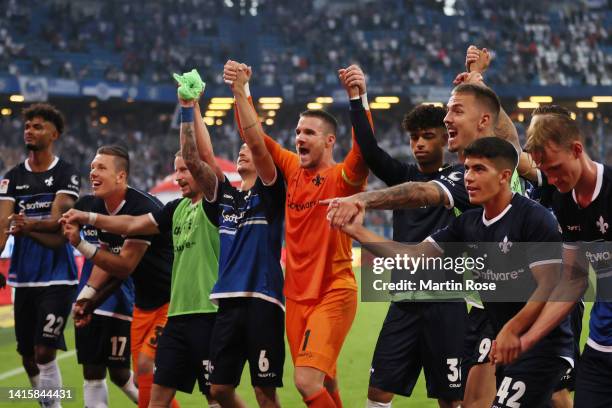 Players of Darmstadt celebrate after the Second Bundesliga match between Hamburger SV and SV Darmstadt 98 at Volksparkstadion on August 19, 2022 in...