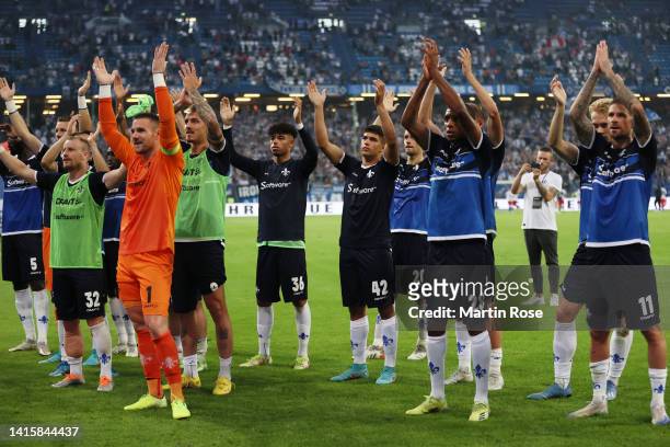 Players of Darmstadt celebrate after the Second Bundesliga match between Hamburger SV and SV Darmstadt 98 at Volksparkstadion on August 19, 2022 in...