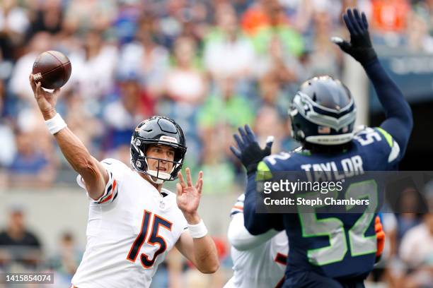 Trevor Siemian of the Chicago Bears passes while pressured by Darrell Taylor of the Seattle Seahawks in the first half during the preseason game...
