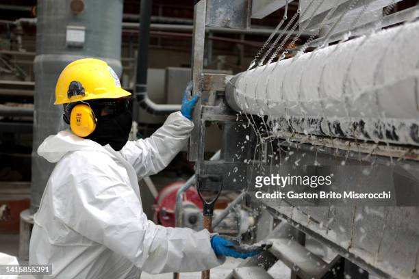 Worker controls the band filter press where the Lithium Carbonate process ends and is ready to be storaged at the Llipi pilot Plant in the Uyuni Salt...
