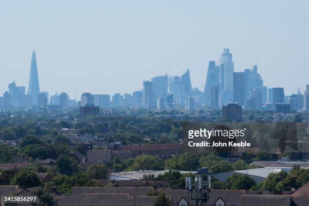 General view looking over rooftops of residential houses toward the London skyline including the Shard, Walkie-Talkie , the Scapel and 22 Bishopsgate...
