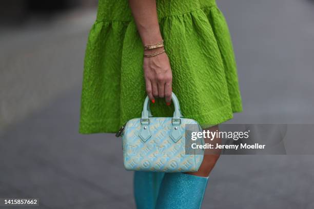 Sonia Lyson wearing Liu Jo x Leonie Hanne sparkling shiny baby blue boots, Louis Vuitton tie dye mini Speedy leather handbag and Essential Antwerp...