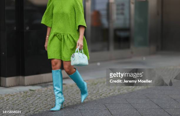 Sonia Lyson wearing Liu Jo x Leonie Hanne sparkling shiny baby blue boots, Louis Vuitton tie dye mini Speedy leather handbag and Essential Antwerp...
