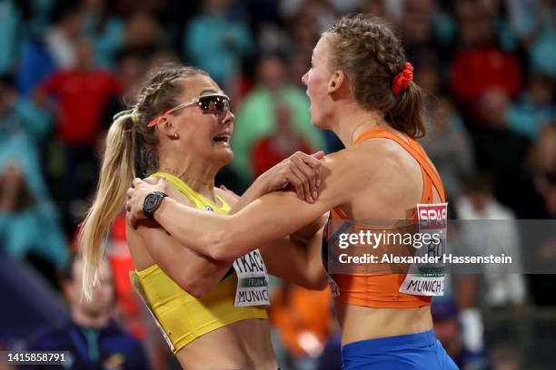 Gold medalist Femke Bol of Netherlands celebrates with Silver medalist Viktoriya Tkachuk of Ukraine after the Athletics - Women's 400m Hurdles Final...