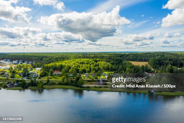 scenic view of lake against sky,karlstad,sweden - karlstad stockfoto's en -beelden