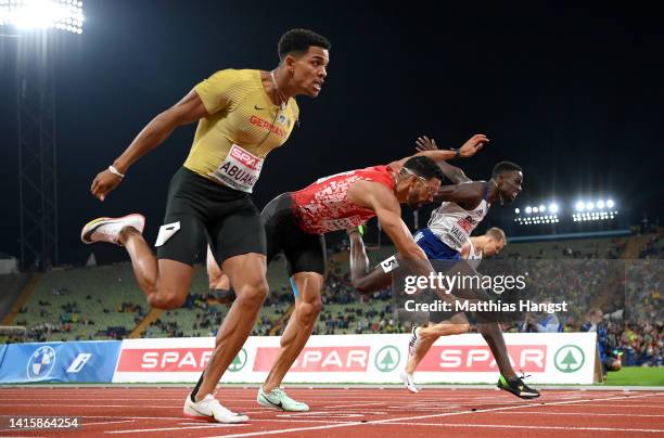 Joshua Abuaku of Germany, Yasmani Copello of Turkey and Ludvy Vaillant of France cross the finish line during the Athletics - Men's 400m Hurdles...