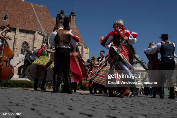 Hungarian traditional dancers from Mera, near Cluj-Napoca, dance near the statue of Matthias Corvinus, during the Hungarian Cultural Days, on August...