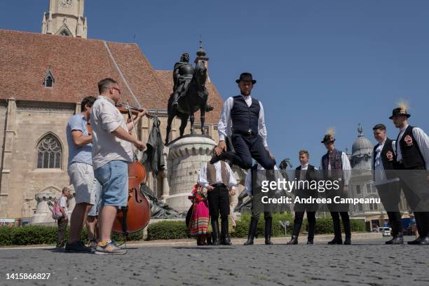 Hungarian traditional dancers from Mera, near Cluj-Napoca, dance near the statue of Matthias Corvinus, during the Hungarian Cultural Days, on August...