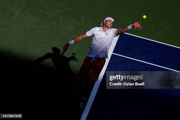 John Isner of the United States serves against Stefanos Tsitsipas of Greece during their Men's Singles Quarterfinal match on day seven of the Western...