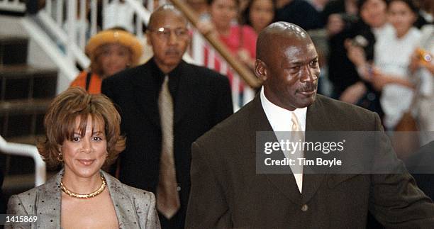 Baskeball legend Michael Jordan and his wife Juanita walk the red carpet May 4, 2000 prior to watching the world premiere of the new IMAX movie...