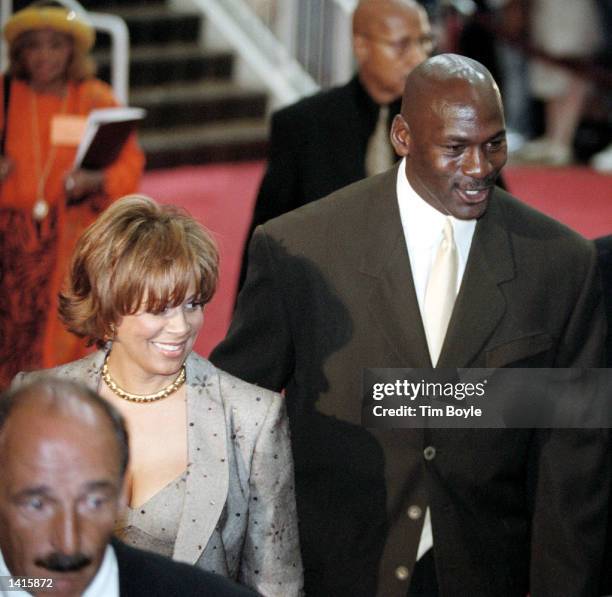 Baskeball legend Michael Jordan and his wife Juanita walk the red carpet May 4, 2000 prior to watching the world premiere of the new IMAX movie...