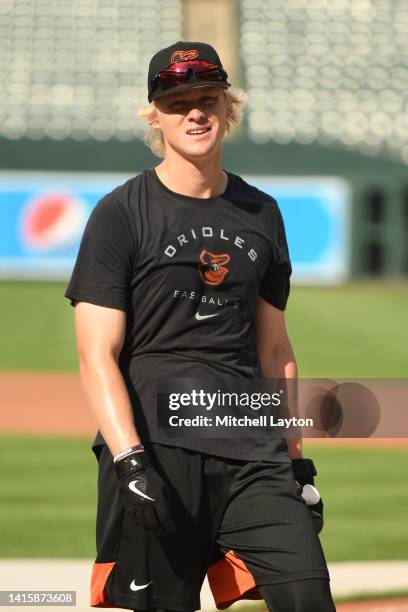 Kyle Stowers of the Baltimore Orioles looks on during batting practice prior to a baseball game against the Boston Red Sox at Oriole Park at Camden...