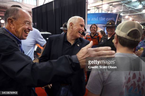 Former Vice President Mike Pence greets attendees as he tours the Iowa State Fair with U.S. Sen. Chuck Grassley on August 19, 2022 in Des Moines,...