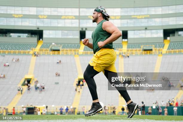 David Bakhtiari of the Green Bay Packers warms up before a preseason game against the New Orleans Saints at Lambeau Field on August 19, 2022 in Green...