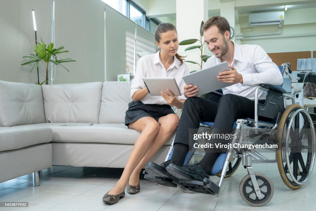 Disable Professional Disabled Professional With Coworkers In Office High-Res Stock Photo ...