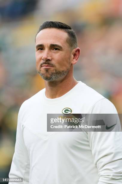 Head coach Matt LaFleur of the Green Bay Packers walks onto the field during warmups before a preseason game against the New Orleans Saints at...