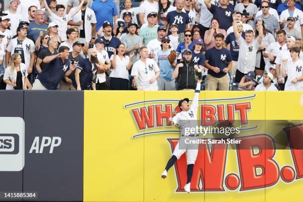 Oswaldo Cabrera of the New York Yankees makes a catch in right field during the first inning against the Toronto Blue Jays at Yankee Stadium on...