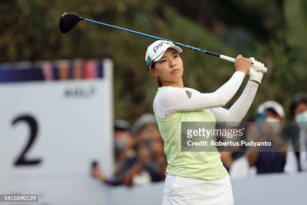 Hinako Shibuno of Japan hits her tee shot on the 2nd hole during day three of the Simone Asia Pacific Cup at Pondok Indah Golf Course on August 20,...